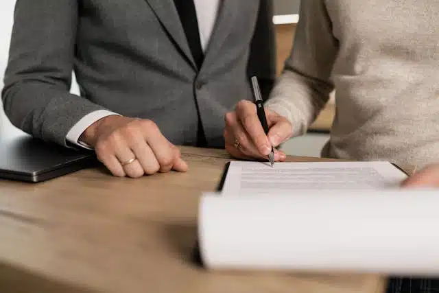 A person signing title pawn paperwork