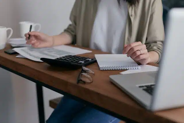  A woman creating a budget at her work desk